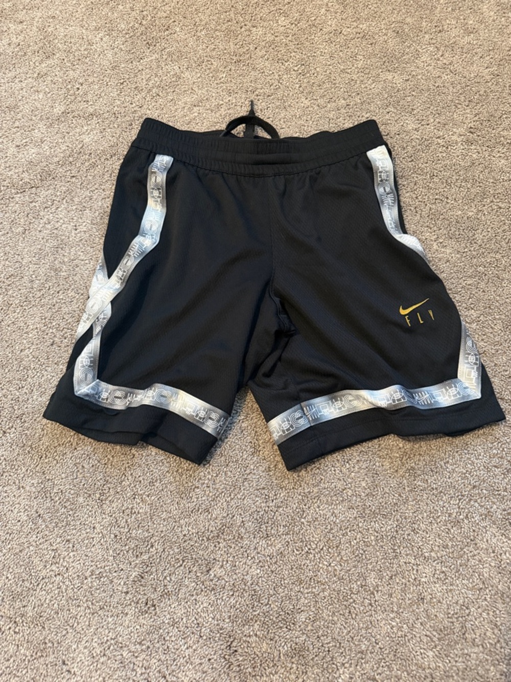 Nike Black Basketball Shorts with Silver Trim and Yellow Swoosh